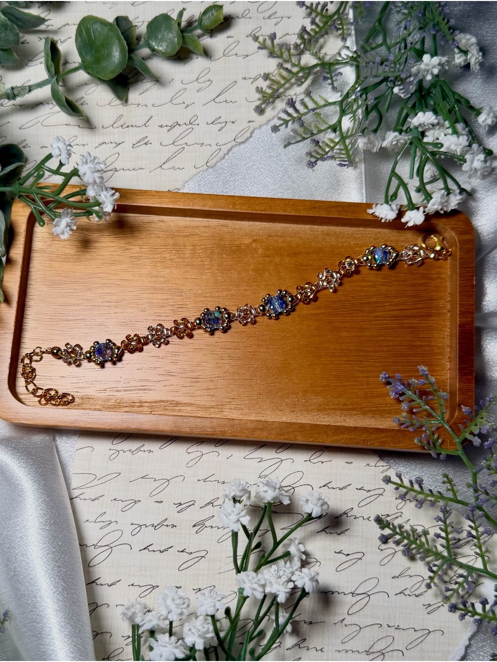 Gold Floral Bracelet with Blue Accent Stones